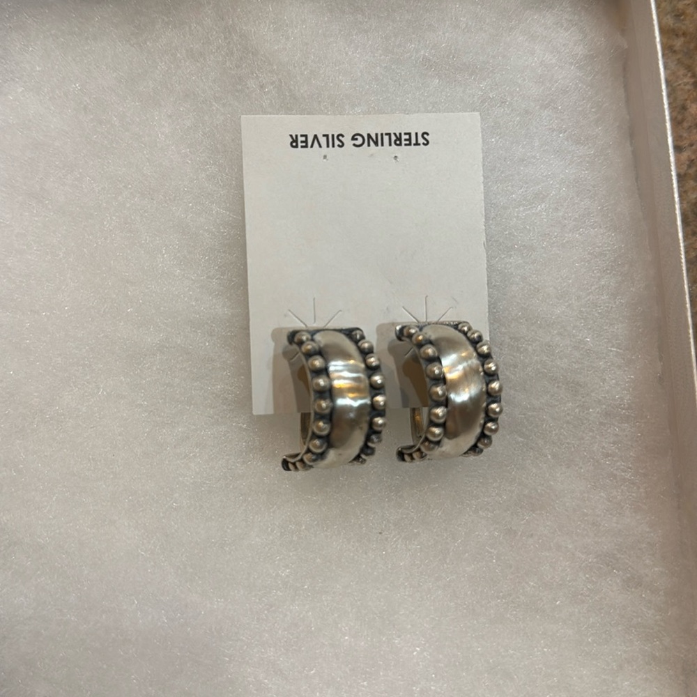 Sterling silver handmade Navajo clip back hoop earrings.